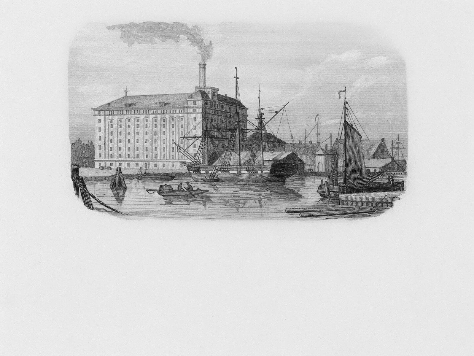 Industrial building with boats in a harbor